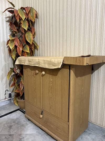 Iron stand with storage drawers