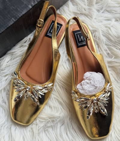 Insignia beaded pumps