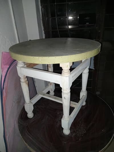 three wooden round tables are available
