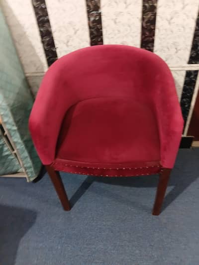Two wooden chairs with velvet poshish
