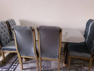 6 _ seater luxury dining table with  Coushnied  chairs.