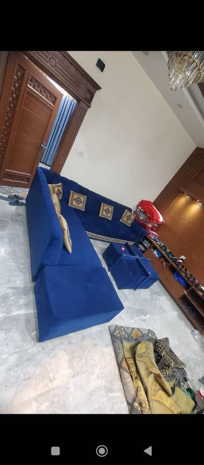 L shaped Blue colour outclass Sofa never used.