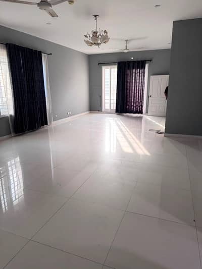 MAGNIFICENT 1200 SQ YD 7-BEDROOM CORNER BUNGALOW FOR RENT ON KHAYABAN-E-MUJAHID DHA PHASE 5