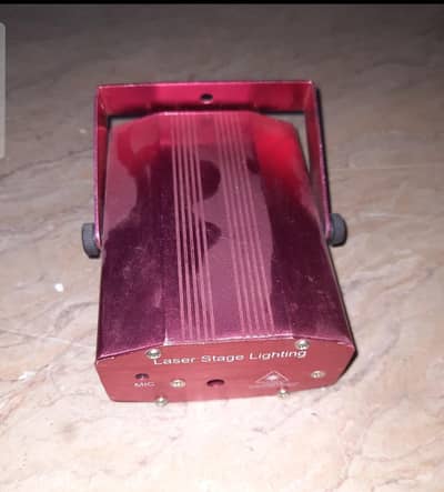 Laser light . Mini Laser Stage light  in Good workng condations.