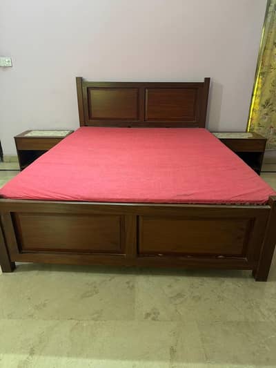 Queen size bed with mattress and side table