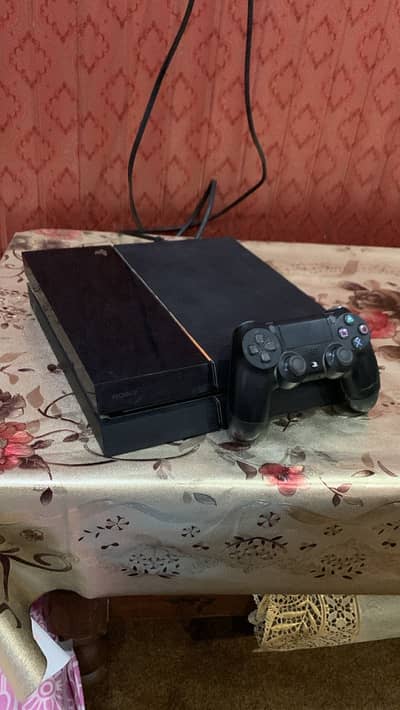 PlayStation 4 in 10/10 condition with original controller