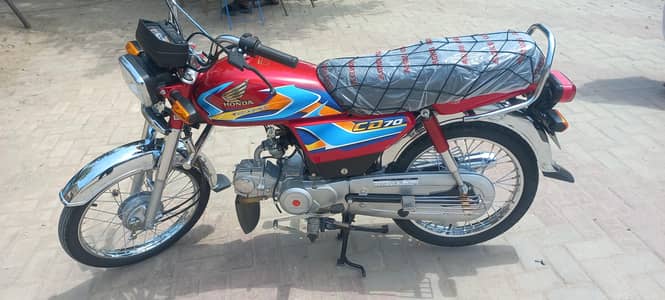 Honda CD 70 model 2026 red colour