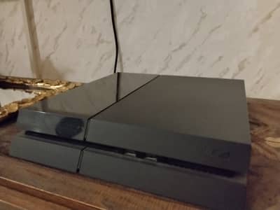 PS4 fat with 4 games pre loaded and 1 controller