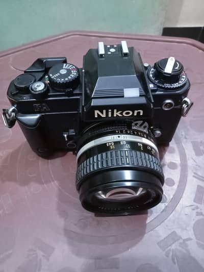 Nikon vintage camera with lens and flash
