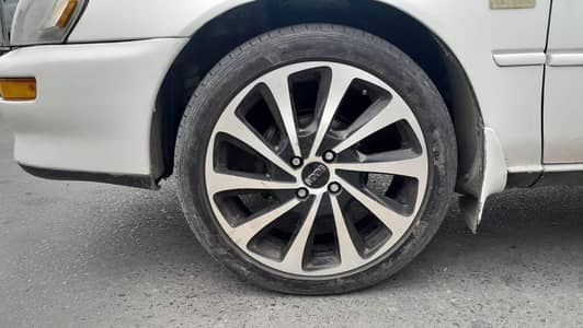 Antique 17 inches rims with low profile dunlop tyres. .