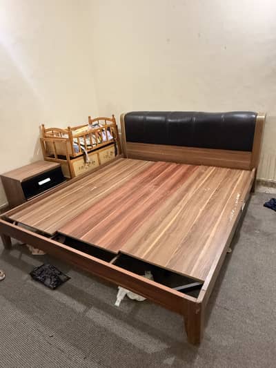 Wooden bed with iron support with mattress