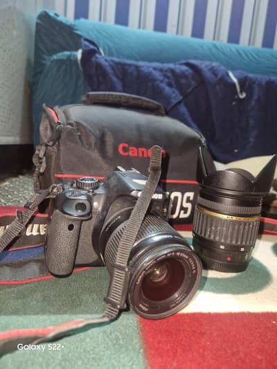 Canon camera with two lenses 1) 17-50mm tamron and 2) ef-c 18-55mm