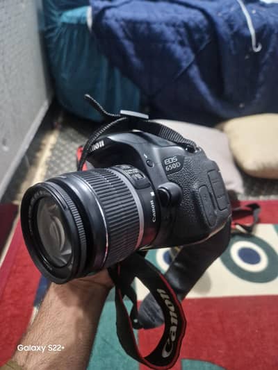 Canon camera with two lenses 1) 17-50mm tamron and 2) ef-c 18-55mm