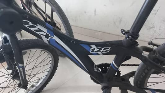 This is a Giant MTX 125 kids' mountain bike