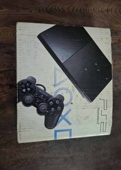 Ps2 with box and games