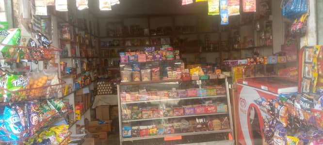 Tuck Shop including a refrigerator