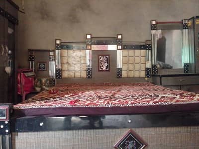 bed and singhar mirror and side table
