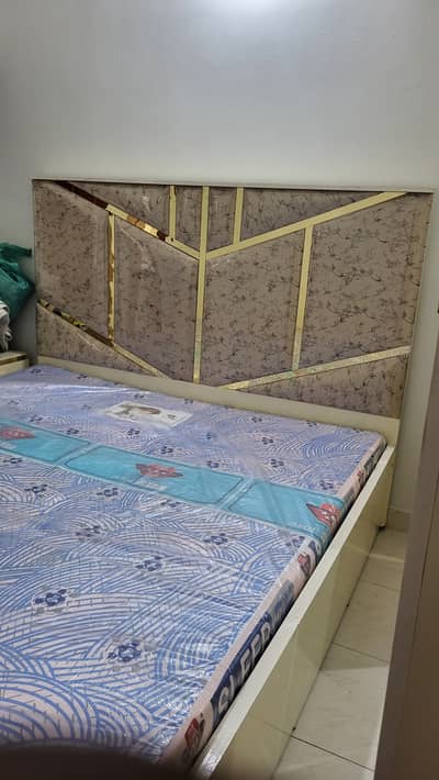 King size Cushioned bed two side table with mattress led lights