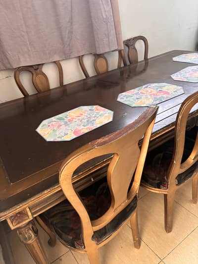 Dining Table in good condition with 8 chairs for sale