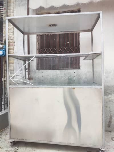 commercial stainless steel food counter with shelves