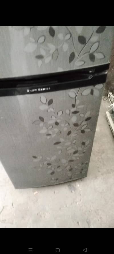 Medium size fridge grew and black colour