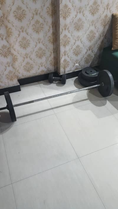 For sale: home fitness setup including 55kg barbell set (4×10kg + 2×5