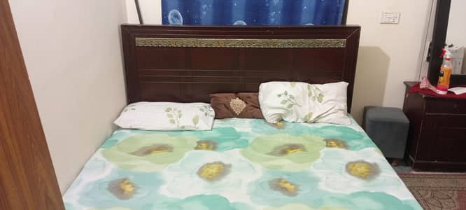 Wooden bed with mattres and dressing table