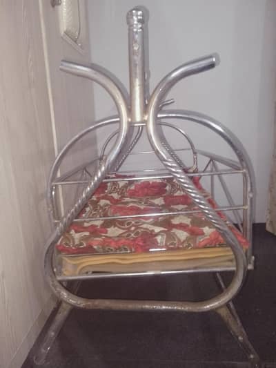 This is a stainless steel baby cradle.