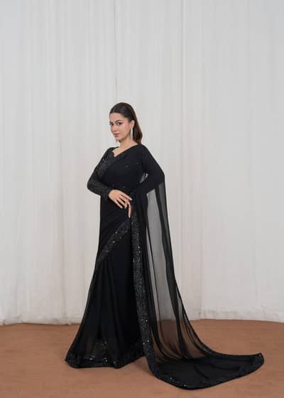 one black saree and diffrent style earings