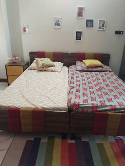 kids single beds along with side tables