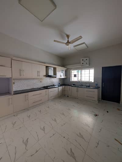 F-10 Excellent 1 Kanal House Double Story House, Spacious Rooms Proper 5 Bedrooms, 5 Attached Bathrooms Modern Fittings Along With Tile Flooring Drawing Dining, TV Lounge, Kitchen, Beautiful Lawn