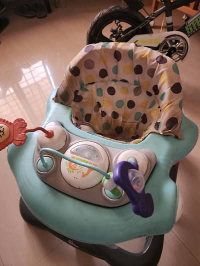 slightly used baby walker branded for sale