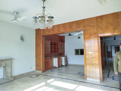 F-11 Excellent 1 Kanal Double Story House Proper And Modern Fittings, Tiled Flooring 5 Bedrooms with 5 Attached Bathrooms TV Lounge. 2 Drawing & Dining Rooms. 2 Kitchens