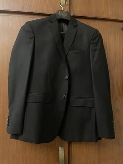 Teen’s black suit custom stitched from Simla clothe house