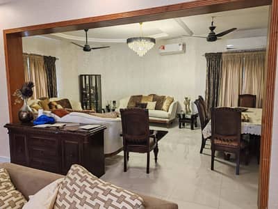 21 Marla Corner Slightly Used Ultra Modern Designer Owner Build Fully Furnished 2 Servant Quarter In Basement Bungalow 10KV Solar Installed For Sale At Prime Location Of DHA Lahore Near To Park Masjid & Commercial Market.