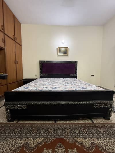 King sized bed . Made with pure wood.