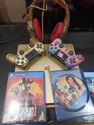 ps4 slim with 2 controller, 2 cds, and some games are installed in ps