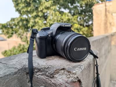 1100D cannon with 18/55 lens and charges