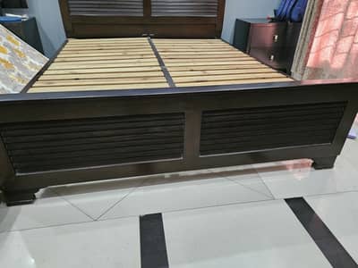 Wooden Bed with side tables is for sale