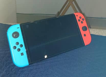 Nintendo Switch OLED Mint condition with box and carry case