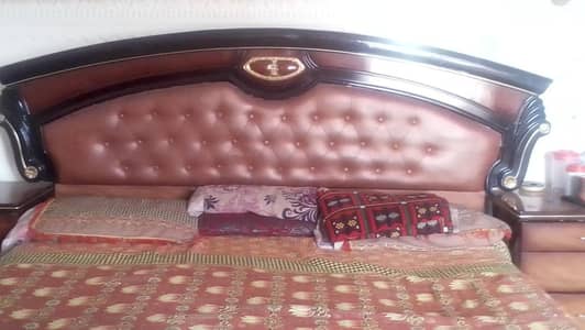 wooden bed with mattres