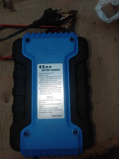 Batry charger good working argent sale last price 2500 .