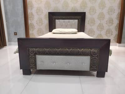 Single Wooden Bed with Decorative Carved Design