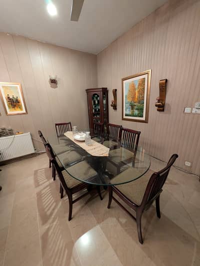 Dinning Table with 8 chairs, Glass top, In very good condition.