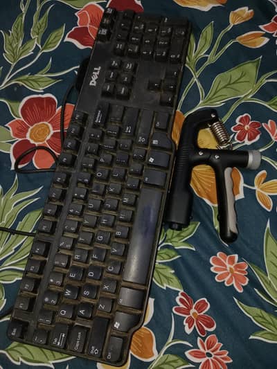 Dell keyboard with free hand gripper