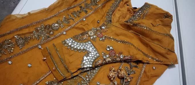 Frick for Mehandi wear in yellow or orange color full heavy.