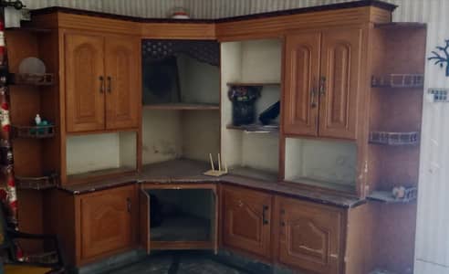 This reddish-brown L-shaped wooden showcase