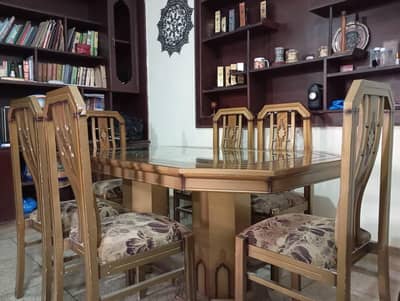 Glass top dining table with six chairs