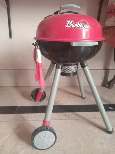 barbecue set with tools and food items