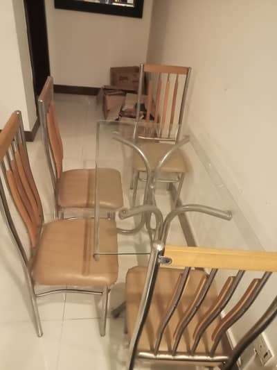 four steel chair and one mirror table